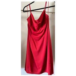 Short red dress with red jewel design on chest
